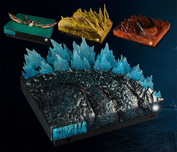 © ign  | Le Xbox One X realizzate da Microsoft per promuovere l'uscita di Godzilla: King of the Monsters.