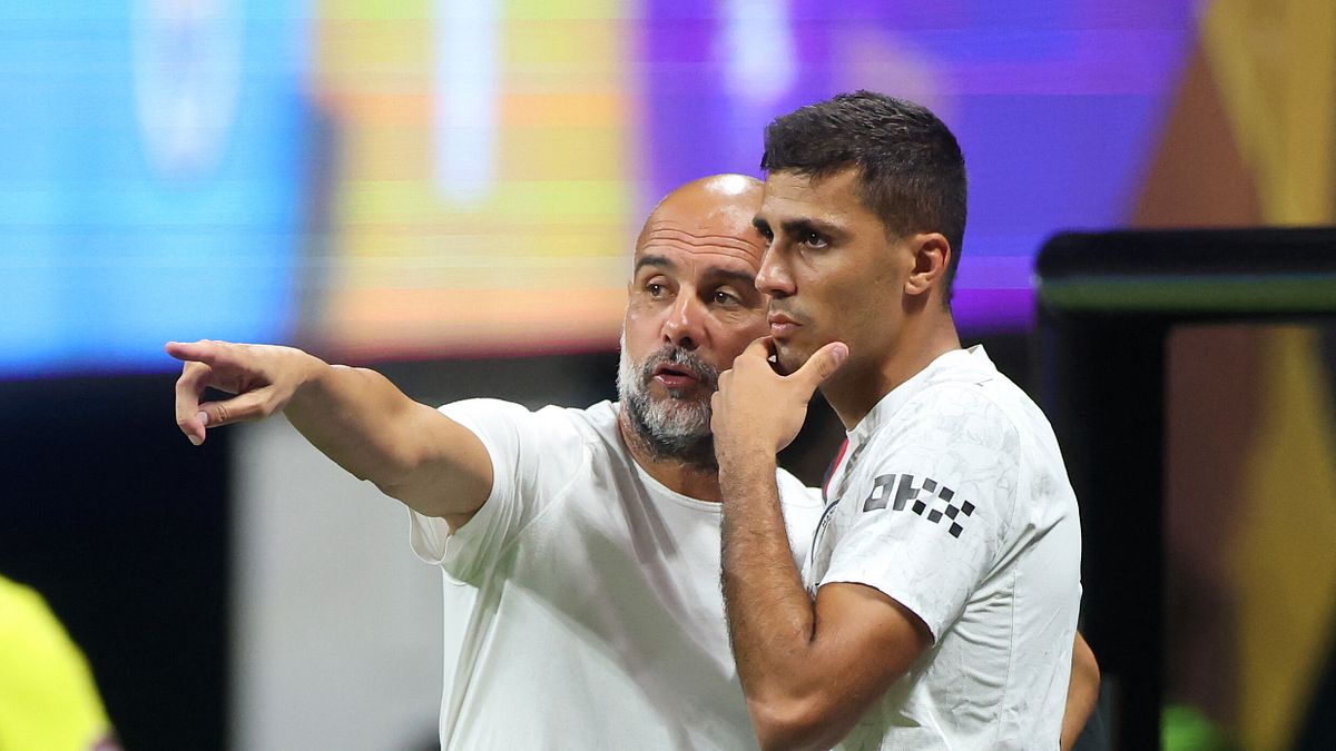 Rodri e Pep Guardiola 