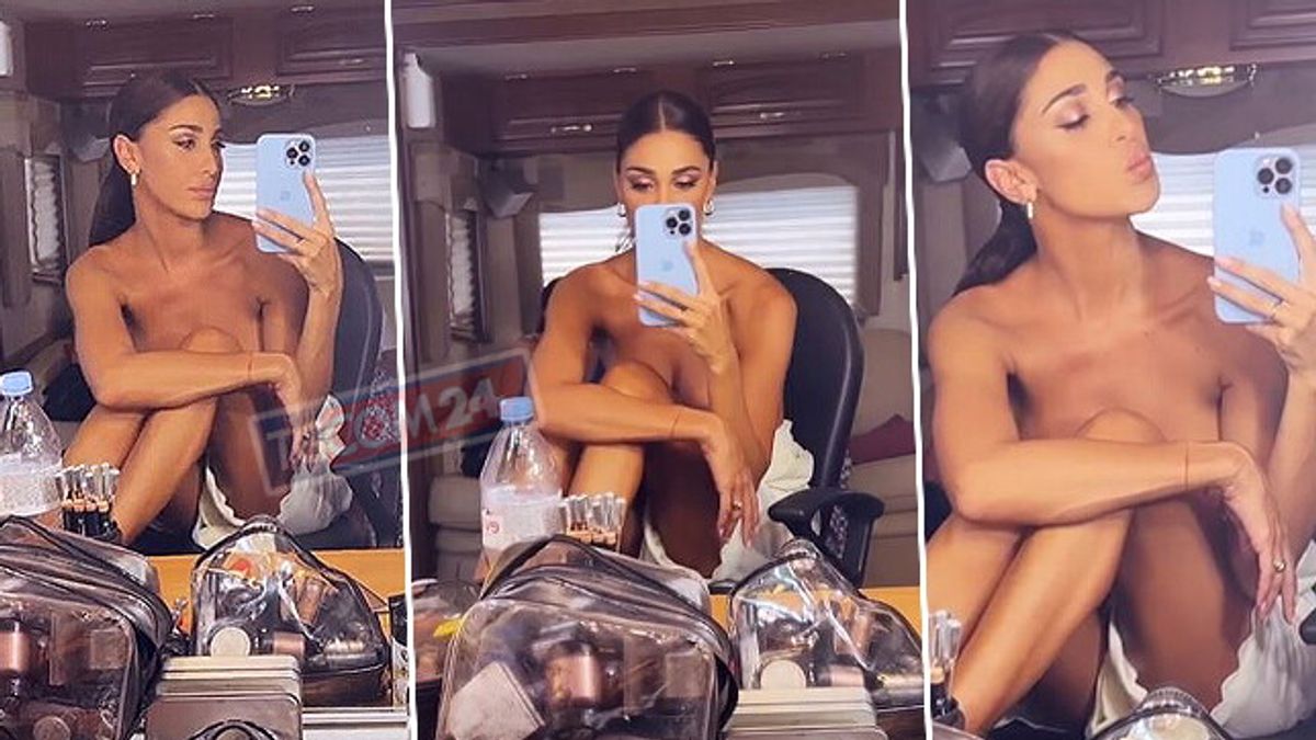 Belen Rodriguez si fa sbirciare in camerino: seno nudo allo specchio -  Tgcom24