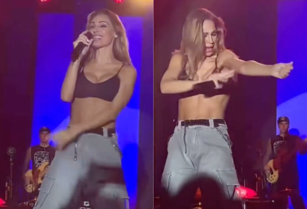 Anna Tatangelo punta da una vespa durante il concerto a Teramo