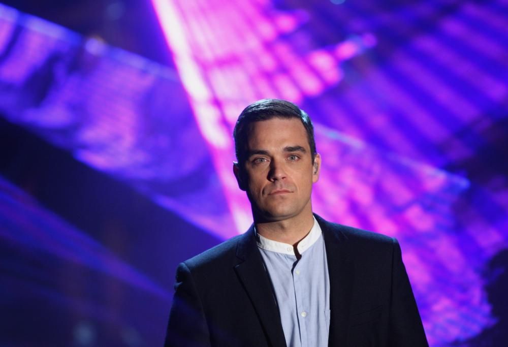 Robbie Williams mette all’asta i suoi Banksy: l’irresistibile video