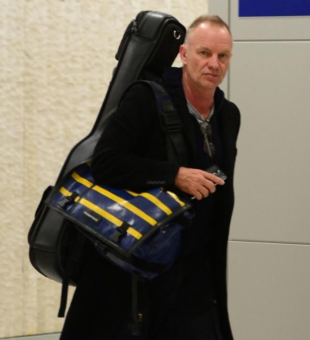 spl737928_009jpg--sting_sticks_his_tongue_out_as_he_departs_jfk_airport