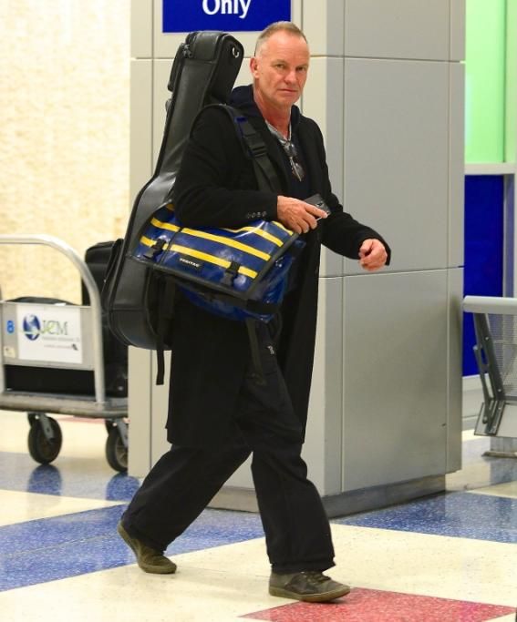 spl737928_001jpg--sting_sticks_his_tongue_out_as_he_departs_jfk_airport