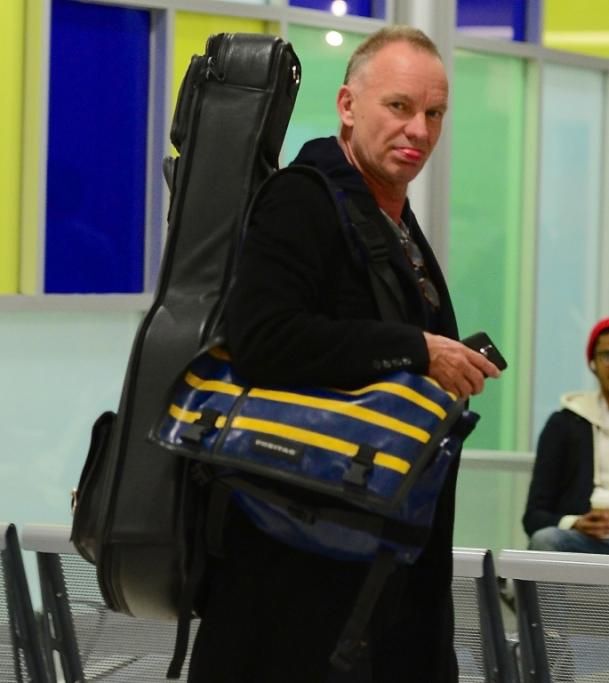 spl737928_002jpg--sting_sticks_his_tongue_out_as_he_departs_jfk_airport