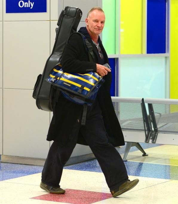 spl737928_012jpg--sting_sticks_his_tongue_out_as_he_departs_jfk_airport
