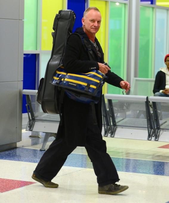 spl737928_013jpg--sting_sticks_his_tongue_out_as_he_departs_jfk_airport