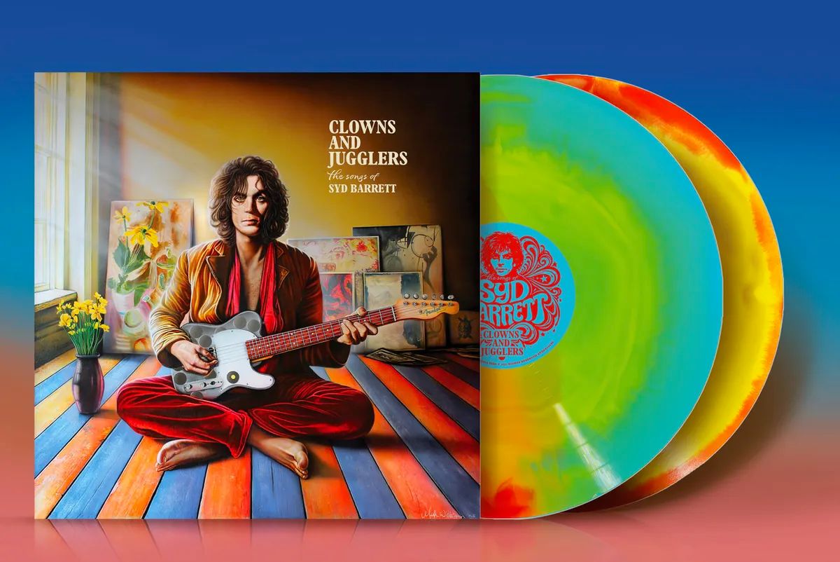 Album cover: a long-haired man in a red outfit sits cross-legged playing a white guitar, colorful striped floor behind him; title 'Clowns and Jugglers' appears.
