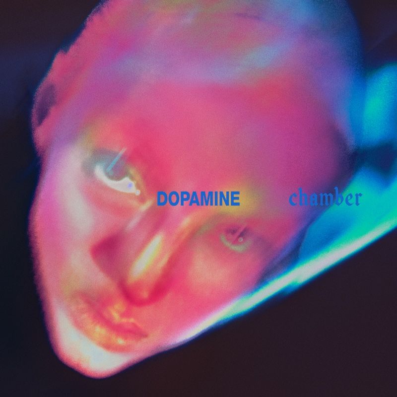 Neon, abstract portrait with a pink–blue color wash and the words 'DOPAMINE chamber' across the center.